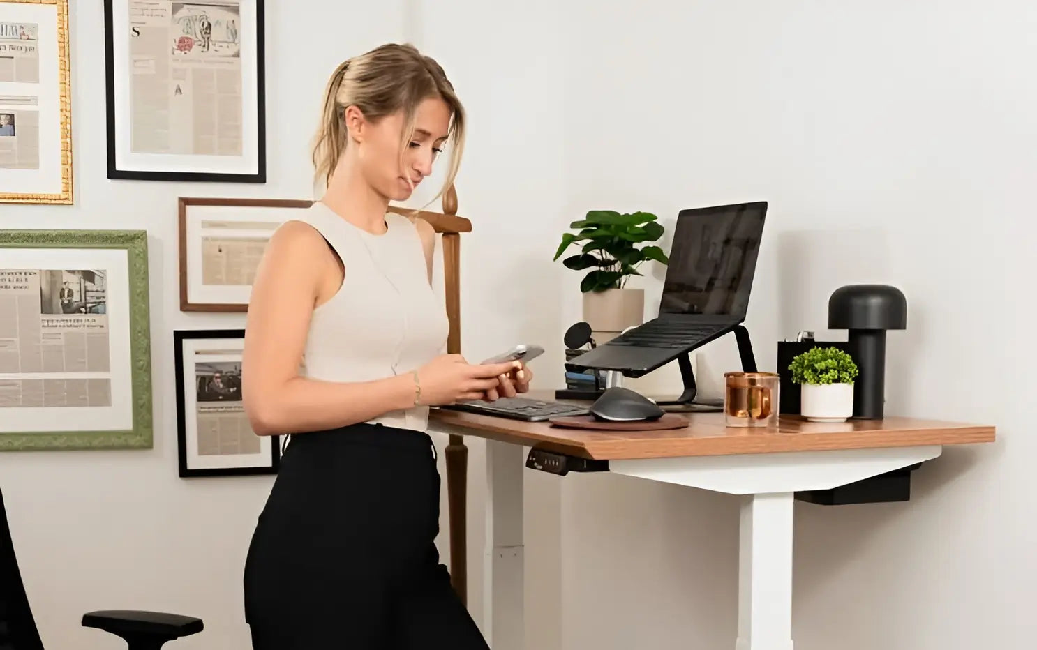 Woman working at a standing desk in a home office