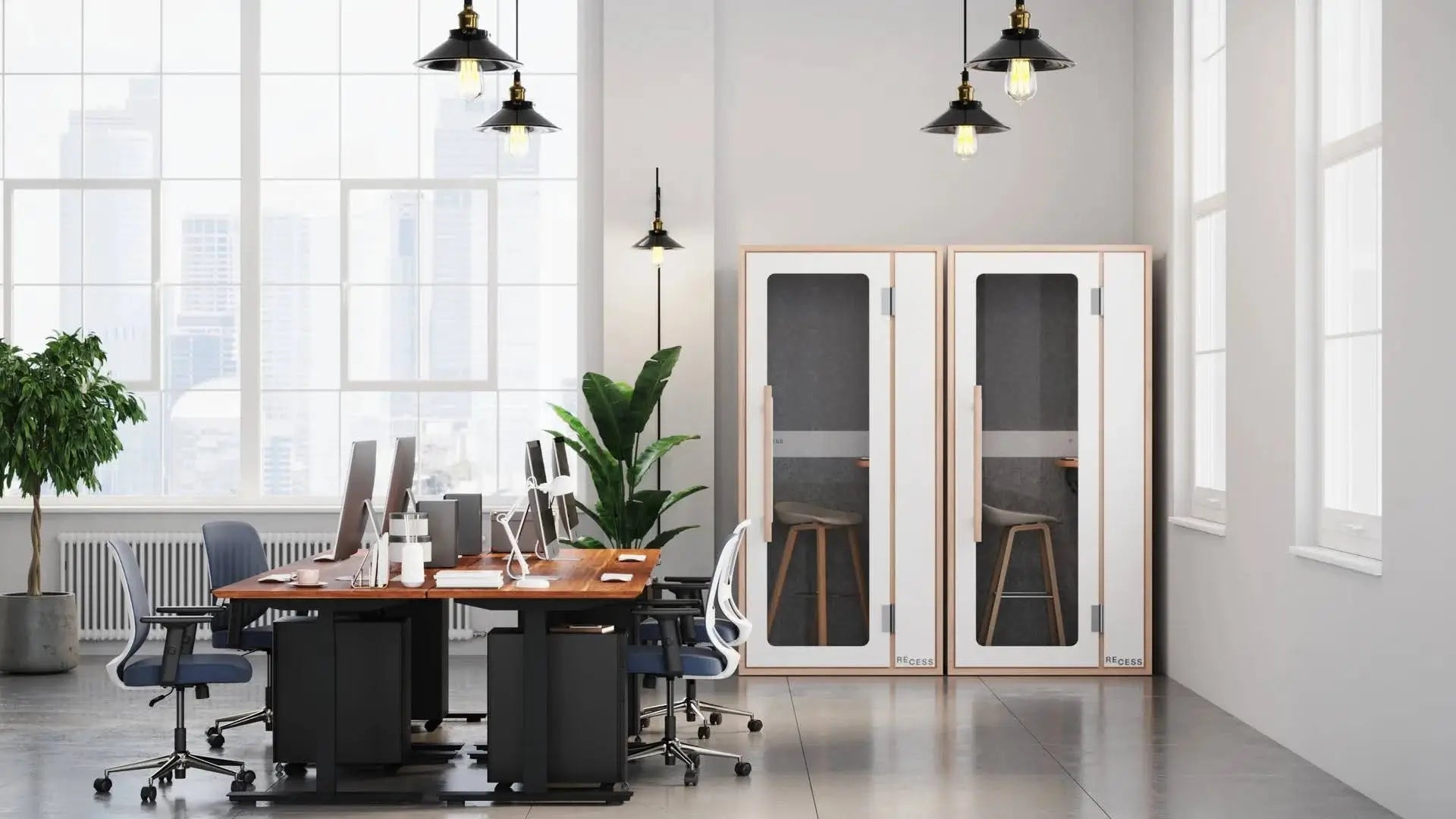 Open plan office with soundproof booths that support the benefits of a quiet room at work