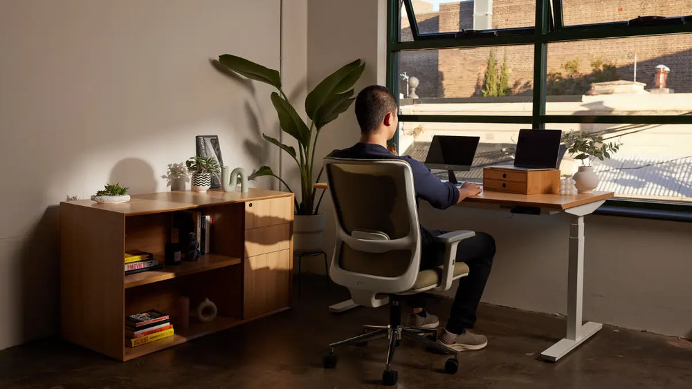 Ergo Bundle with ergonomic chair and standing desk in a home office